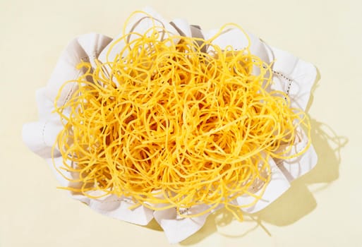  Fresh tagliatelle pasta in white napkin , beautiful long flat yellow ribbons of raw pasta