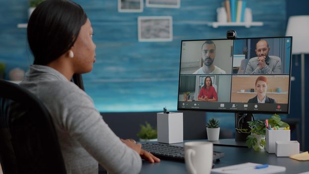 Black student talking with marketing university team during online videocall meeting conference teleconference explaining school virtual course. Computer user african woman working remote from home