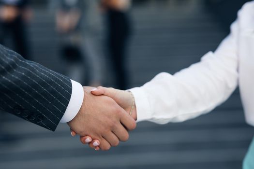 Close up Business People Shaking Hands Corporate Partnership Deal Welcoming Opportunity for Cooperation. Handshake of two people. Successful deal concept