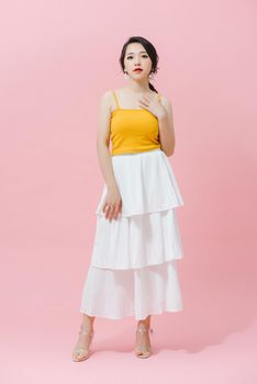 Fashion portrait of beautiful young woman in a summer dress