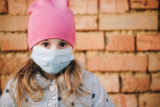 Closeup Of Beautiful Girl Wearing Medical Mask During Coronavirus COVID-19 Epidemic. Concept of health and safety life, N1H1 coronavirus, virus protection.