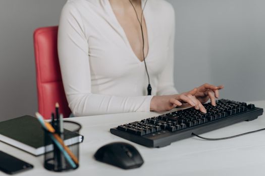 Closeup coding, Woman hands coding html and programming on screen laptop, development web, developer. Female hands type on keyboard. No face woman sits on sofa freelancing working at home.