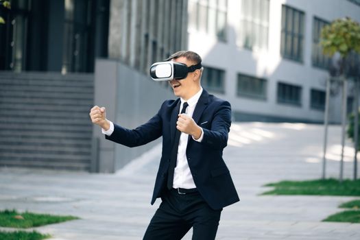 Man playing racing games using vr headset. Cheerful young gamer in virtual reality goggles is expressing excitement while enjoying car racing video game. Man wearing VR glasses watch Driver POV