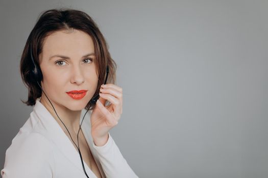 Support phone operator in headset using personal computer. Agent Woman Smiling in Call Center Employees Work in Office.