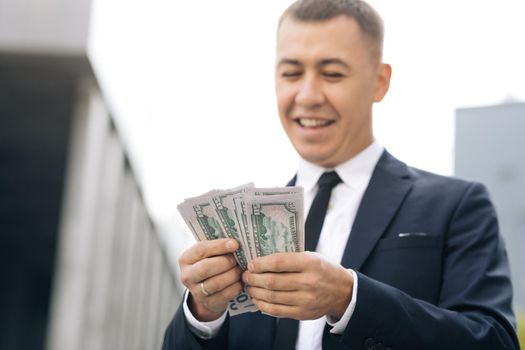 World economic crisis. Businessman Counting Money Usd Bills Payday. Total unemployment in a pandemic. Bribe. Dirty money. Successful business. Symbol of success, gain, victory.