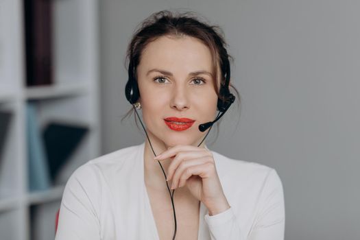 Face Young Female Woman Operator Look at Camera Smile in Call Center Office Business Worker Computer Corporate Headset Job Service Group Finance