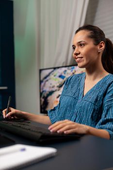 Portrait of woman photographer working on design with digital tablet and stylus for editor work at office studio. Template artist doing photo editing on image with modern equipment