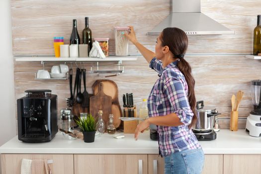 Housewife preparing breakfast in kitchen. Beverage, herbal lifestyle, drink, young, indors,