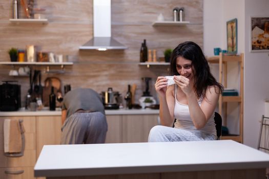 Desperate addicted woman holding bag with narcotic drugs having forbidden habit. Adult junkie with cocaine, heroin dependence craving illegal powder being unhealthy and depressed