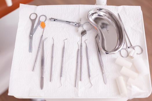 Professional dental stomatology teeth tools standing on modern equipment in orthodontic hospital office room. Workplace cabinet for hygiene tooth , dentistry treatment clinic