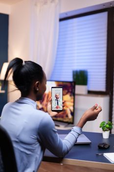 Dark skinned sick woman discussing with medical physician in the course of online consultation. Black patient in a video call with medic discussing health problems of woman.