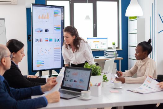 Furious woman screaming at company office boardroom meeting having disagreement controversy. Businesswoman raging about multitasking difficult job, screaming in boardroom