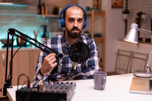Vlogger speaking at podcast using production station in home studio. Creative online show On-air production internet broadcast host streaming live content, recording digital social media communication
