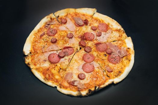 Delicious hot pizza. Hot tasty italian pizza from open box, food delivery service at party catering concept. Opens a pizza box.