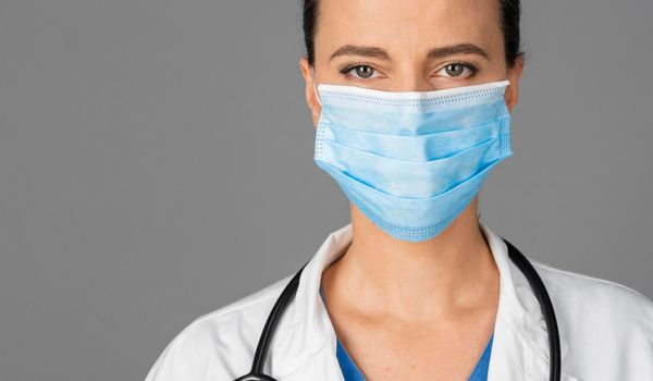 female doctor hospital wearing mask. High resolution photo