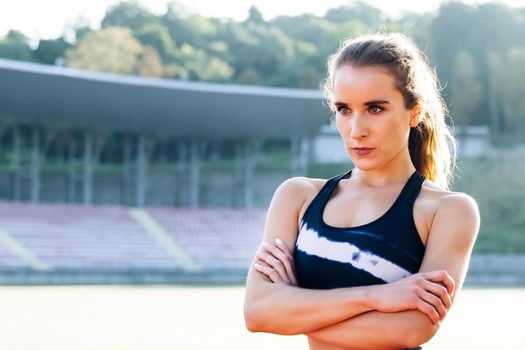 Fitness lifestyle portrait, caucasian model, trained body, copyspace. Portrait of fitness woman in sport clothes professional athlete after physical training.