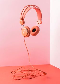 pink headphones with cable flying. High resolution photo