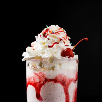 delicious strawberry milkshake beverage front view. High resolution photo