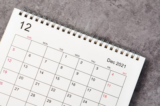 Close up December desk calendar 2022 on wooden background.
