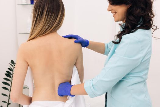 Physiotherapy Improves the Patient's Quality of Life. Doctor Collects a Complete Medical History of Back Problems and Performs a Detailed Physical Examination.