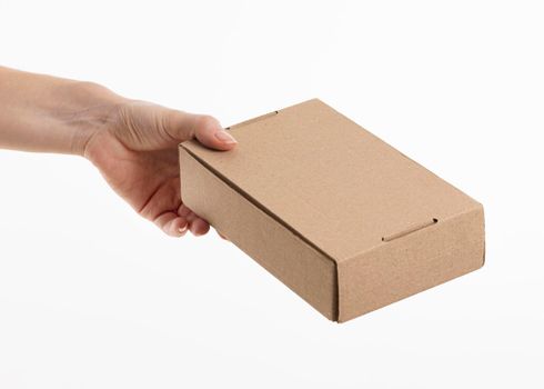 hand giving cardboard box. High resolution photo