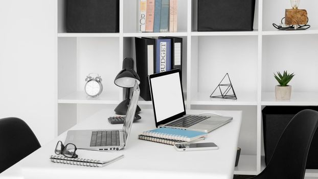 office desk surface with two laptops. High resolution photo