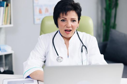 Female doctor make online video call consult patient. Caucasian woman therapist videoconferencing talking to camera in remote chat. Telemedicine, telehealth.