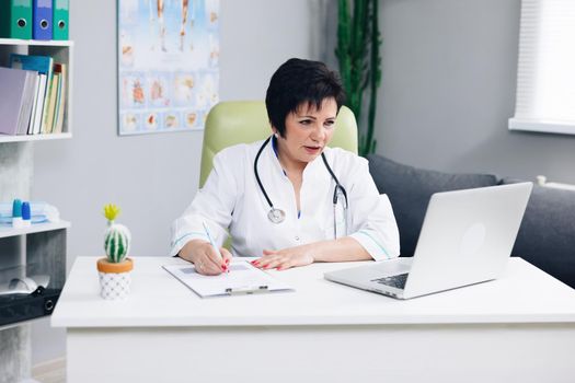 Female doctor talk with patient make telemedicine online webcam video call. Woman therapist videoconferencing on computer in remote telemedicine laptop virtual chat. Telehealth concept