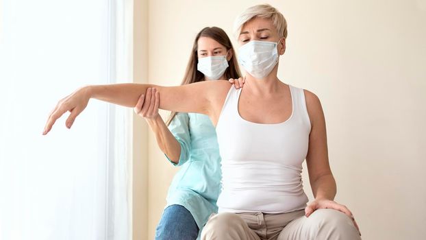 female patient undergoing therapy physiotherapist. High resolution photo