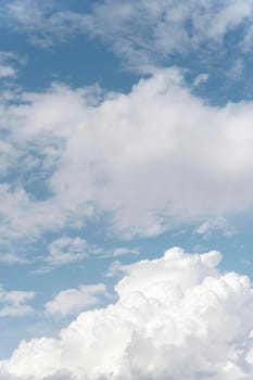 fluffy clouds sky vertical shot. High resolution photo