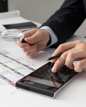 business man calculating finance numbers. High resolution photo