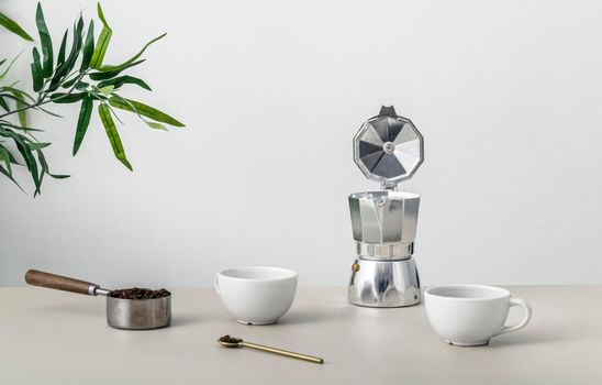 front view table with coffee cup kettle. High resolution photo