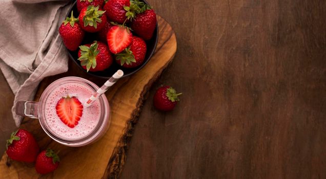 top view strawberry milkshake straw. High resolution photo