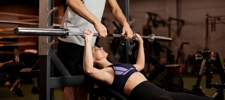 woman lifting bar. High resolution photo