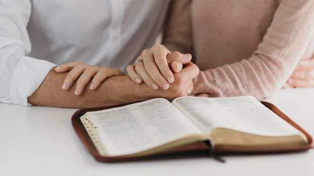 husband wife reading bible together. High resolution photo