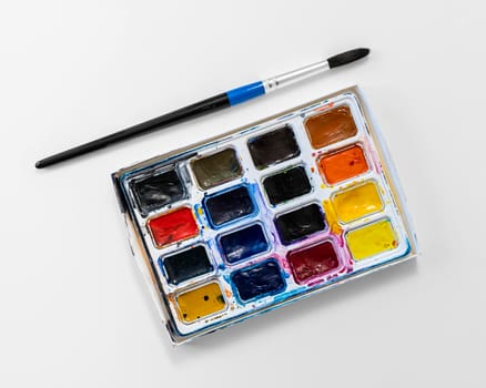 top view used color palette box paint brush. High resolution photo