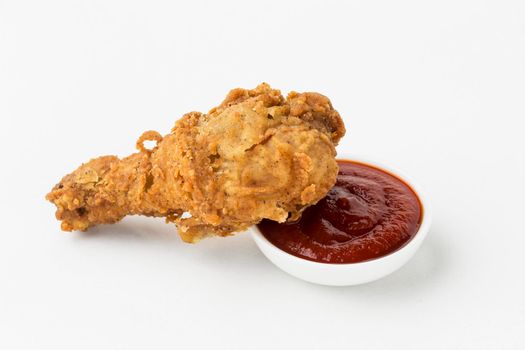 high angle fried chicken drumstick ketchup. High resolution photo