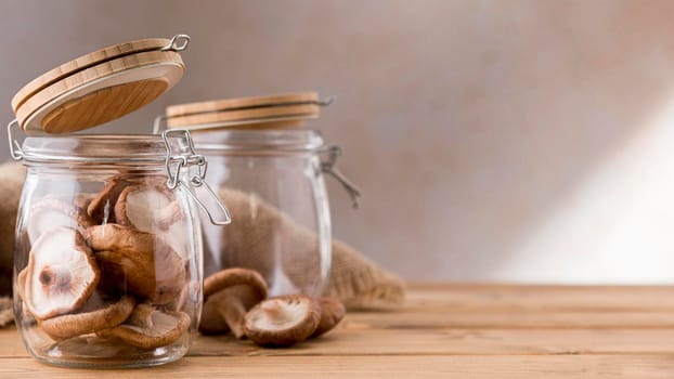 front view mushrooms clear jars. High resolution photo