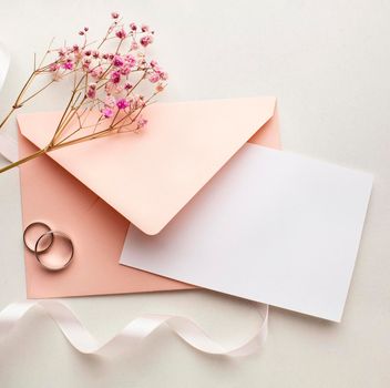 pink flowers envelope save date wedding concept. High resolution photo