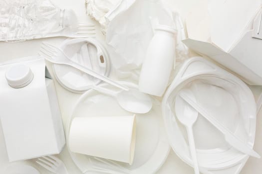 top view arrangement dirty plastic waste. High resolution photo