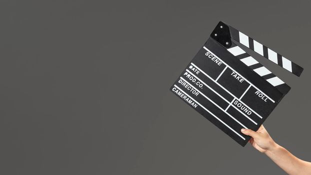 hand with movie slate. High resolution photo