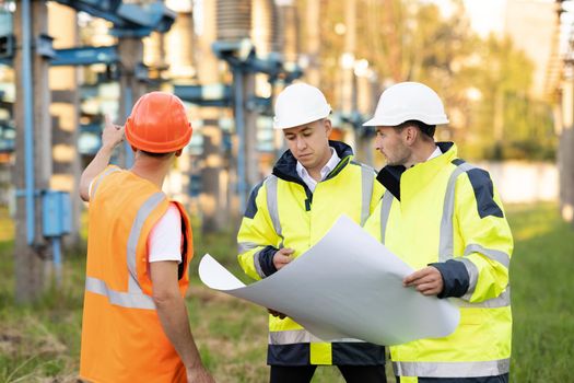 Diverse Team of Specialists on Construction Site. Real Estate Building Project with Engineer, Investor and Businessman Checking Area, working on Civil Engineering, Discussing