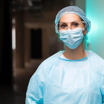female doctor wearing protective clothing. High resolution photo