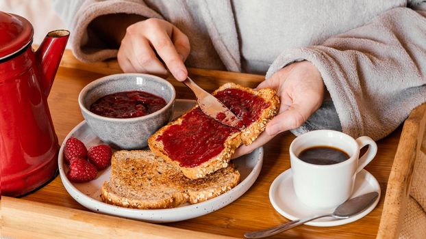hand putting jam bread. High resolution photo