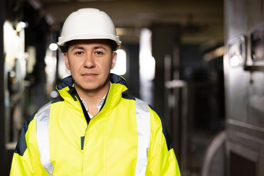 Caucasian Business People in Hard Hat or Safety Wear. Confident Contractor or Attractive Mechanic of Machine Inspection for Machinery Tool Job Close-up Indoors. Engineer Plan of Manufacture Work.