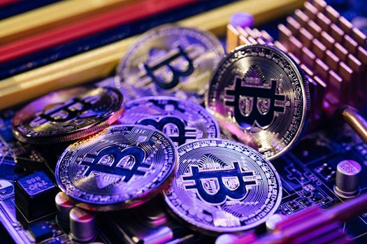 Golden Bitcoins. New virtual money. Mining Golden Bitcoins. Bitcoins coins isolated on motherboard background. Crypto currency, bitcoin. BTC, Bit Coin. Blockchain technology