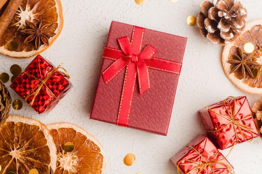 New Year's gift layout on a white background. An article about choosing a gift for a holiday. Red gift wrapping. New Year and Christmas