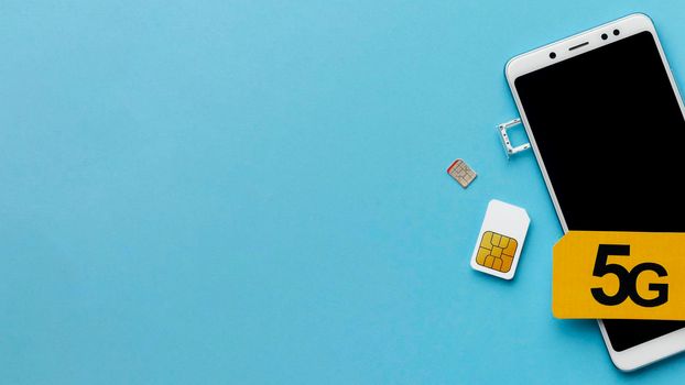 top view smartphone with sim card copy space. High resolution photo