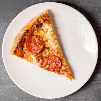flat lay slice pepperoni pizza plate. High resolution photo