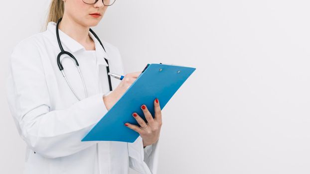 crop doctor writing clipboard. High resolution photo